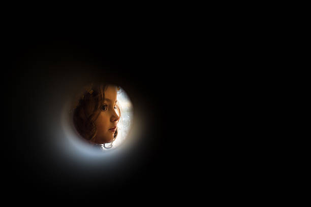 istock Young child seen through a tube 515147216