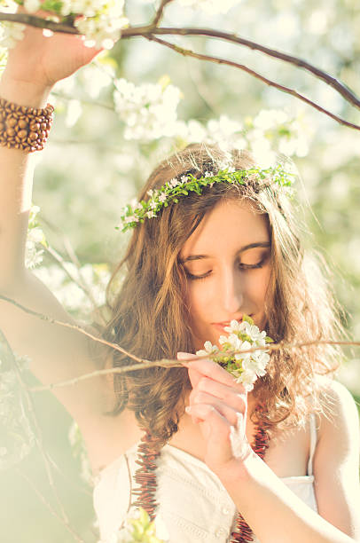 istock Girl with Cherry Blossoms smelling 515147442