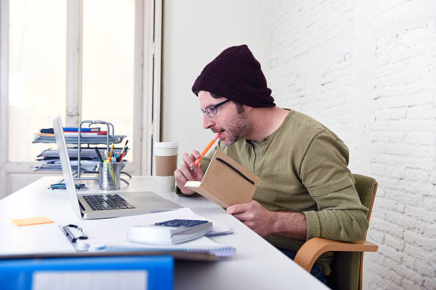 istock young hipster businessman working from home office as freelancer 515149166