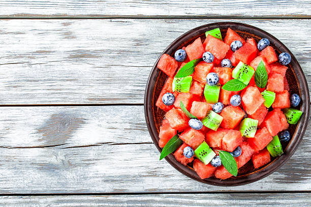 istock Watermelon and Blueberry salad on an earthenware dish top view 515150418