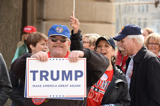 Saint Louis, MO, USA - March 11, 2016: Donald Trump supporter holds sign outside the Peabody Opera House in Downtown Saint Louis