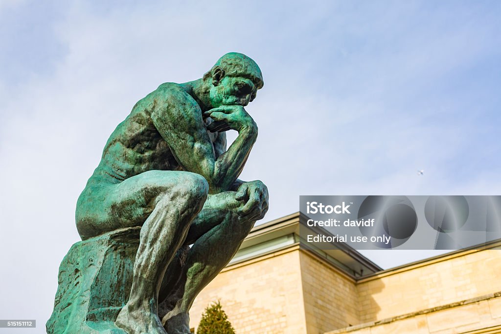 August Rodin's Famous Sculpture The Thinker Paris, France - December 5, 2015: August Rodin's famous sculpture The Thinker in the grounds of the Musee Rodin, Paris Contemplation Stock Photo