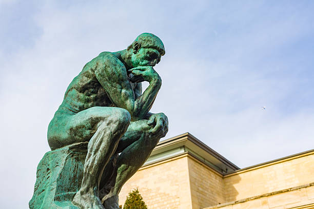 August Rodin's Famous Sculpture The Thinker Paris, France - December 5, 2015: August Rodin's famous sculpture The Thinker in the grounds of the Musee Rodin, Paris statue stock pictures, royalty-free photos & images