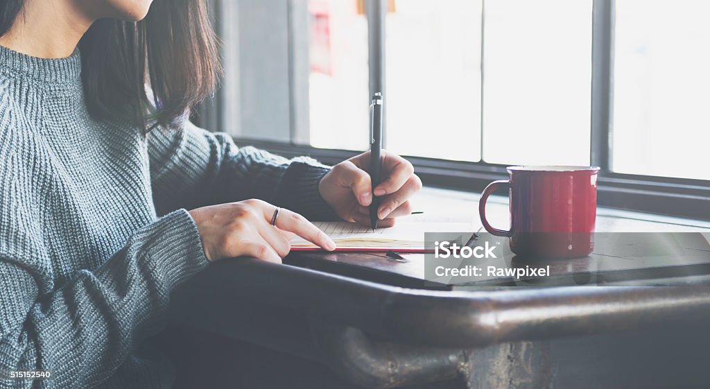 Asian Lady Writing Notebook Diary Concept Writing - Activity Stock Photo