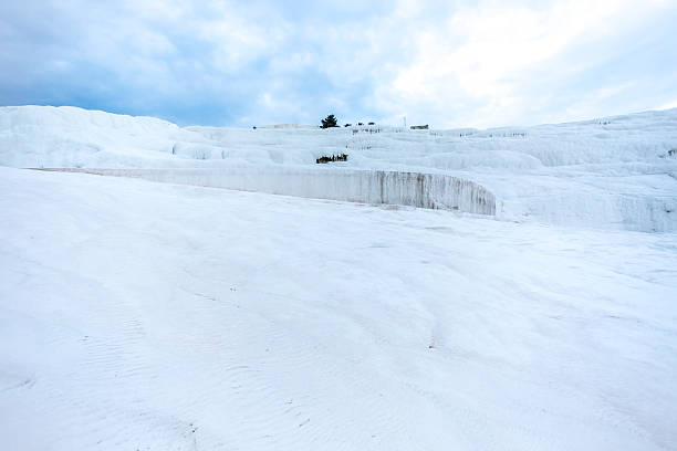 istock Blue-white picture of limestone hills 515155380