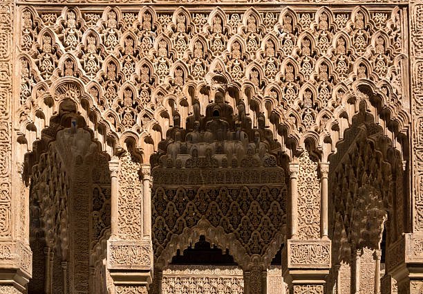 Detail of ornate decoration at Alhambra Palace in Granada, Spain. This photograph was taken at the entrance to Patio de los Leones (Court Of The Lions).