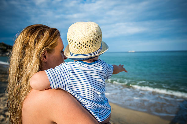 istock Mother and her son on beach 515157358