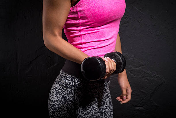 istock Woman holding a hand weight 515157824