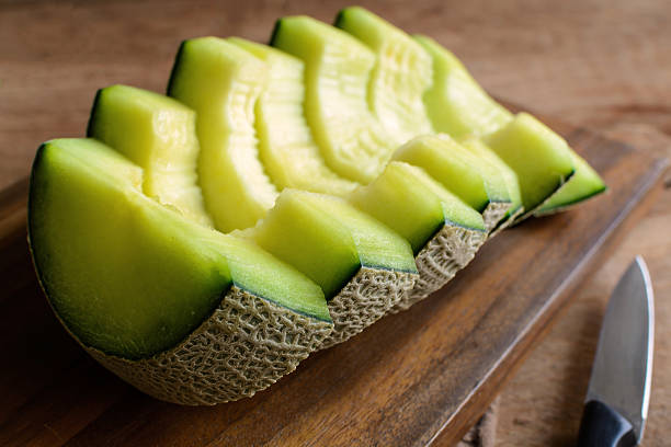 istock Juicy slice melon on a wooden table 515160740