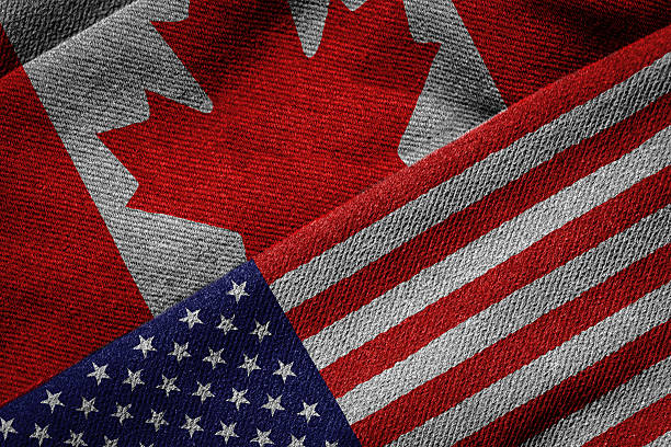 3D rendering of the flags of USA and Canada on woven fabric texture. Detailed textile pattern and grunge theme.