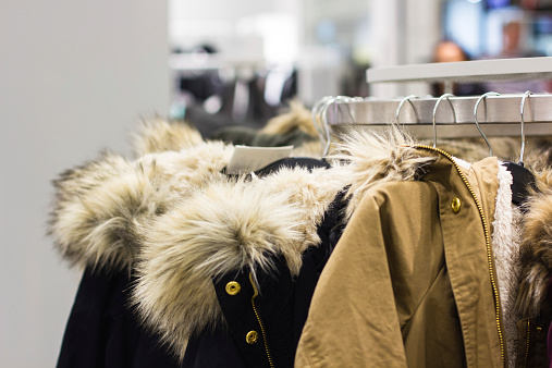 Fur Hooded Jackets  for women on coat-hanger