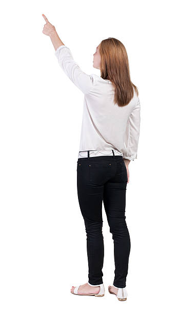 istock Back view of  pointing woman. 515168231