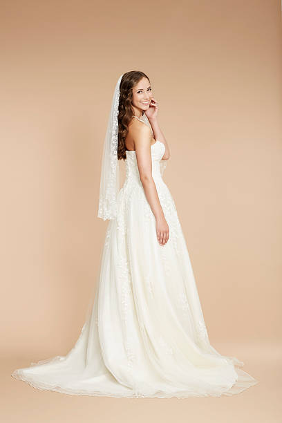 istock Elegant young bride in wedding dress, studio shot 515169733