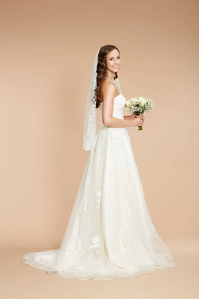 istock Elegant young bride in wedding dress, studio shot 515169741