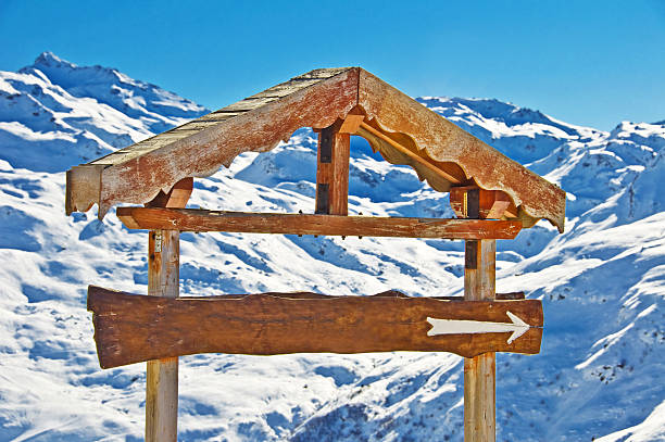 istock Blank rustic wooden sign, snowy mountain background 515169829
