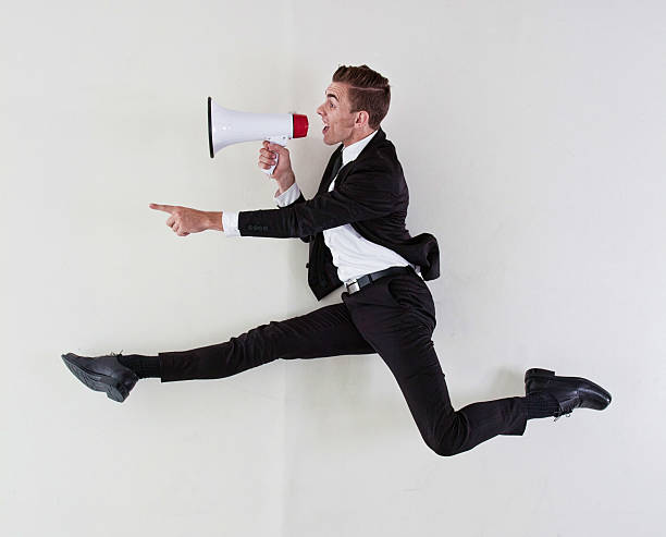 istock Businessman shouting & pointing with megaphone 515170127