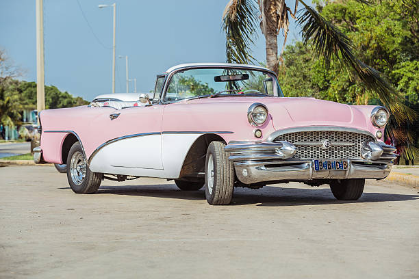 istock Old vintage pink & white classic car 515171459