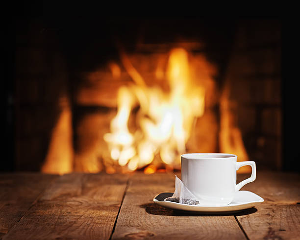 istock White cup of tea with teabag on wooden table. 515186386
