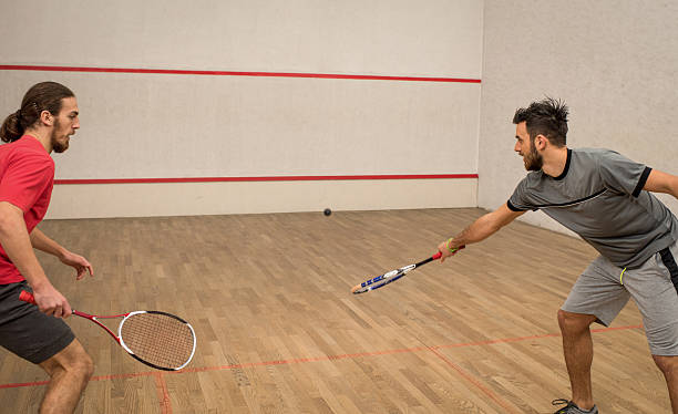 istock Two young athletic men playing squash on a court. 515191862