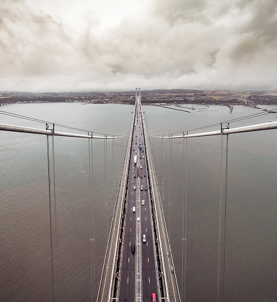 A high angle view of traffic on the Forth Road Bridge over the Firth of Forth between Fife and the Lothains, taken from the north tower of the bridge.