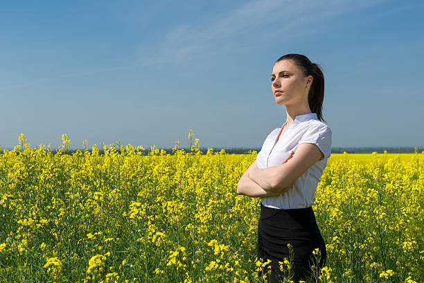istock woman in yellow flower field 515196281