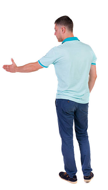 istock Back side view of man  in shirt handshake. 515196629