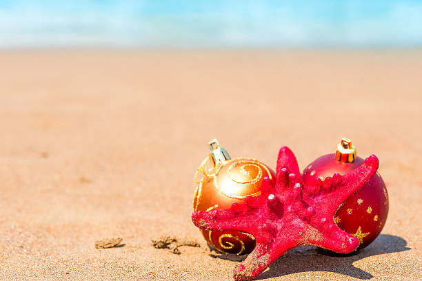 istock starfish and balls for the Christmas tree on the beach 515196891