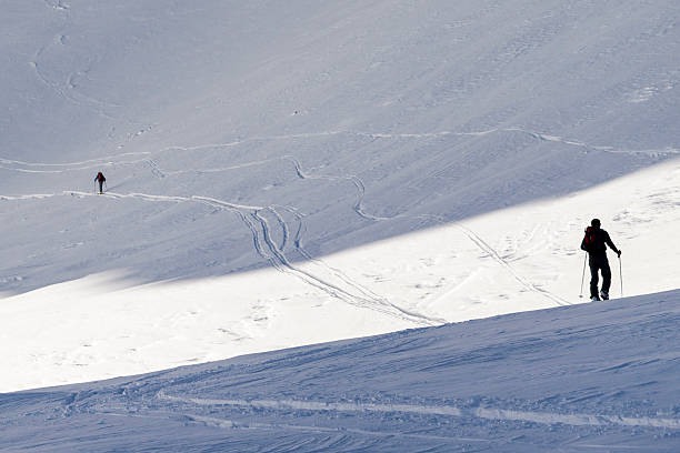 istock two skiers are separated by a light line 515197471