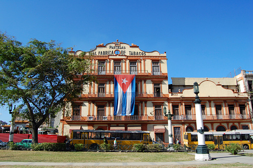 Havana, Сuba - January 28, 2009: exterior of the famous cigar factory in Havana, Cuba during the 50th anniversary of the revolution. Partagas is one of the oldest cigar brands in Cuba.