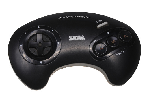 Adelaide, Australia - February 23, 2016: A studio shot of a sega mega drive game controller. A 16-bit video game console developed by Sega. Sold during the Late eighties and early ninties.