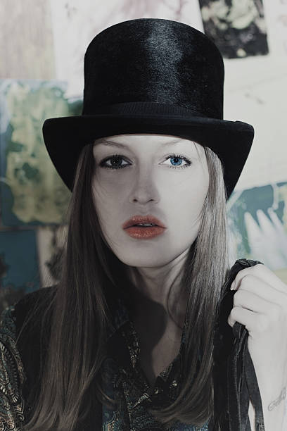 istock Beautiful young woman dressed in black high hat 515199446
