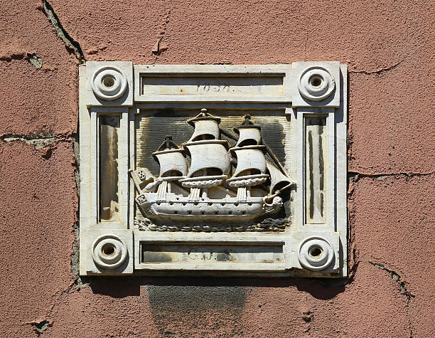 Old sailing ship represented in outdoor bas-relief of  Lisbon, Portugal.