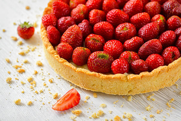istock Strawberry tart on white wooden background 515199725