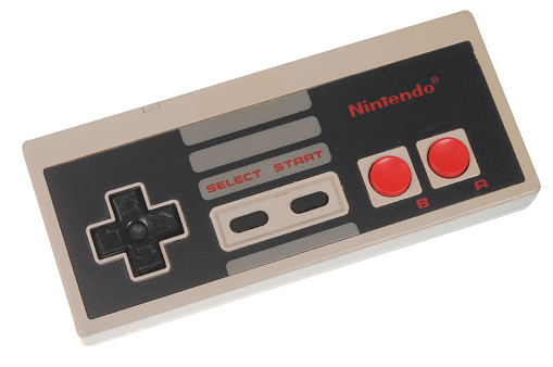 Adelaide, Australia - February 23, 2016: A studio shot of a Nintendo Entertainment System (NES) Controller. A popular 8-bit entertainment system sold worldwide during the 1980's.