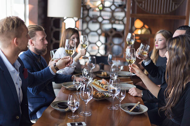 Friends toasting wine in restaurant