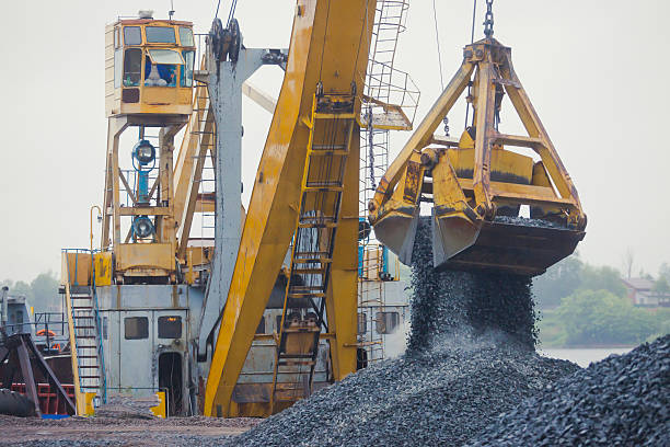 istock Heavy excavator and bulldozer unloading road metal during road work 515203419