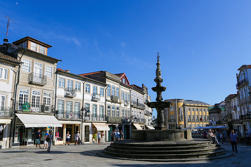 Viana do Castelo, Portugal - August 4, 2014: Unidentified people at the Chafariz Fountain and old Town Hall at the Praca da Republica in Viana do Castelo, Portugal.