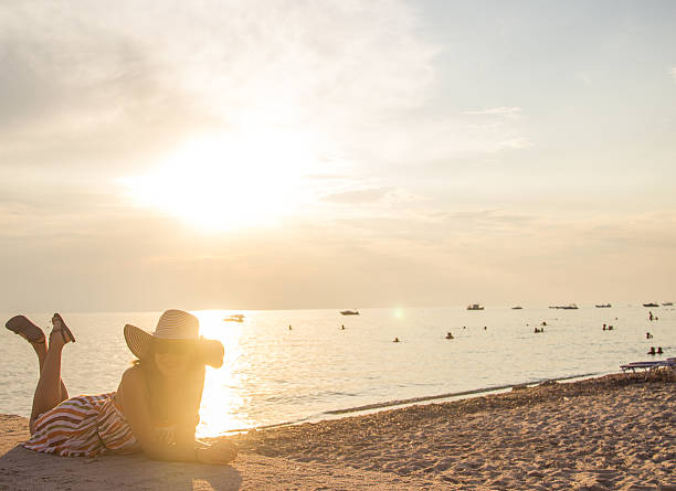 istock Sunset / Beautiful young woman in her vacations 515220133