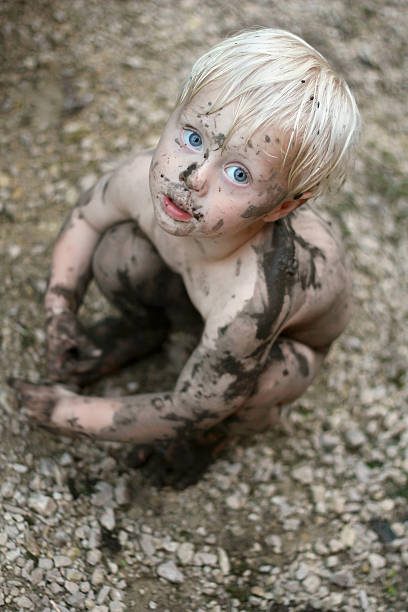 istock Adorable Dirty Baby Child Looking at Camera 515221551