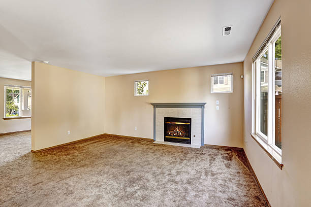 istock Empty house interior. Bright ivory living room with fireplace 515221629