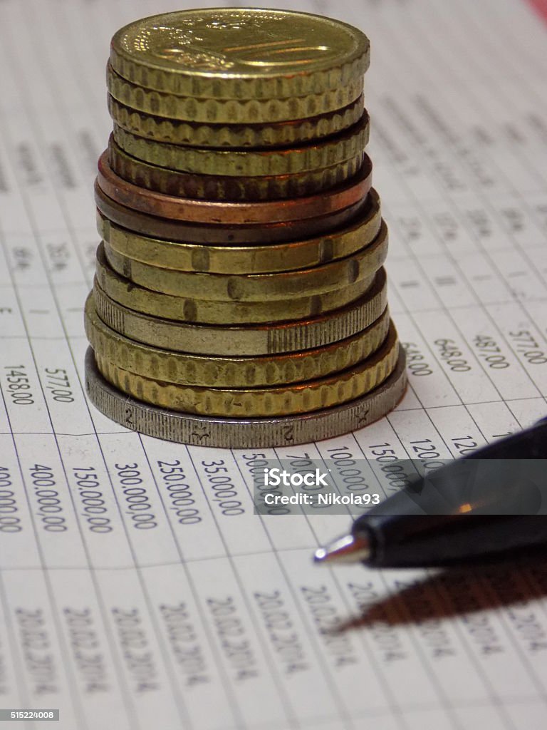 Euro coin pile on financial paper Euro coins pile on financial paper Bank Account Stock Photo