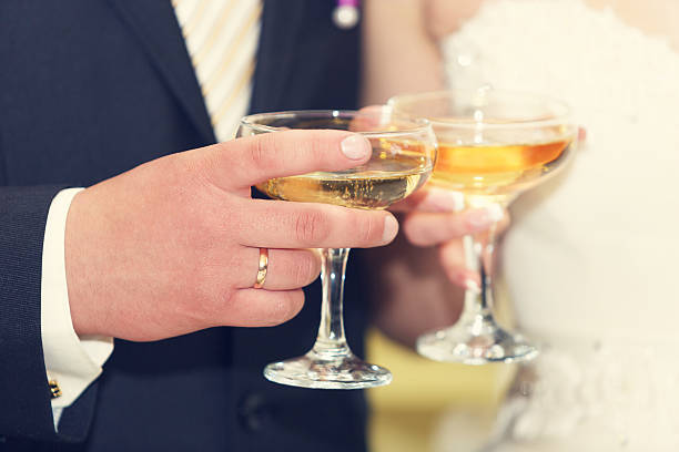 istock wine glasses in hand bride and groom. 515224595