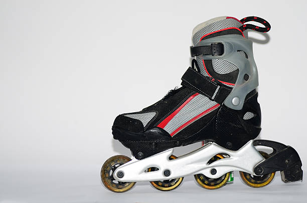 istock rollerskates for men in gray and red on a white 515224997