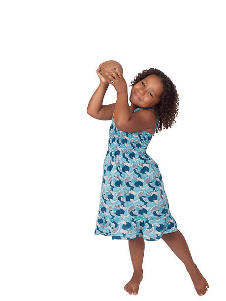 Little Ghanaian - Canadian Girl with coconut stock photo