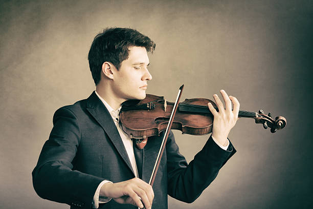 istock Man violinist playing violin. Classical music art 515225129