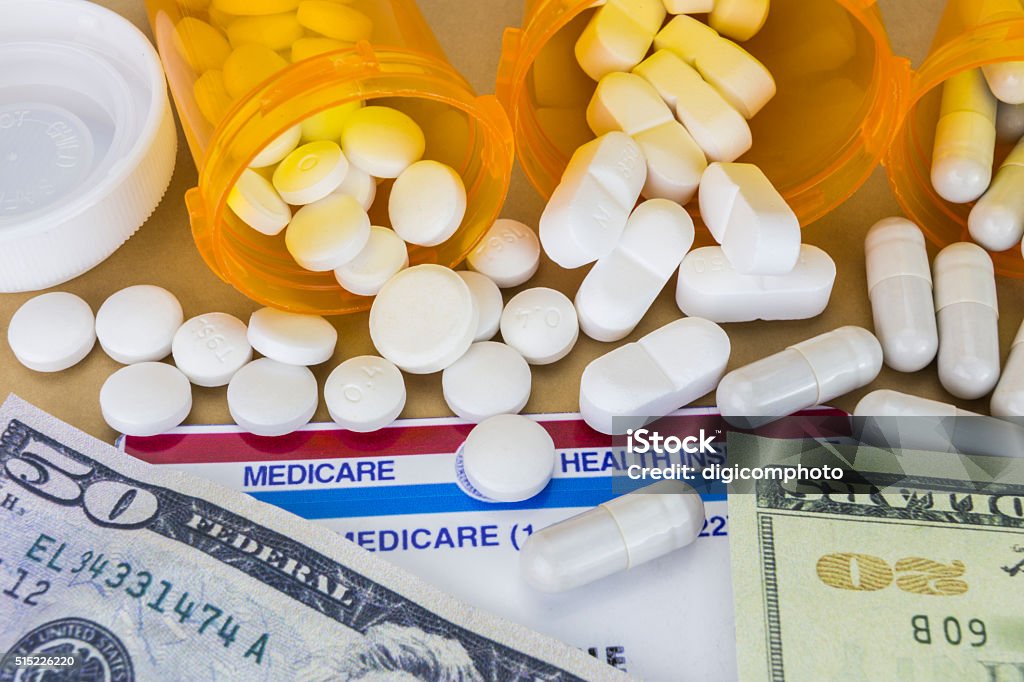 capsules up ticket dollar, concept of health copay Currency Stock Photo