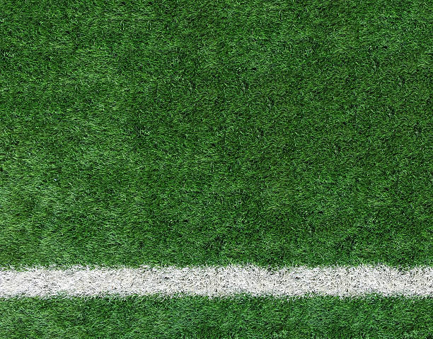 istock White Stripe Line on The Green Soccer Field Top View 515226386