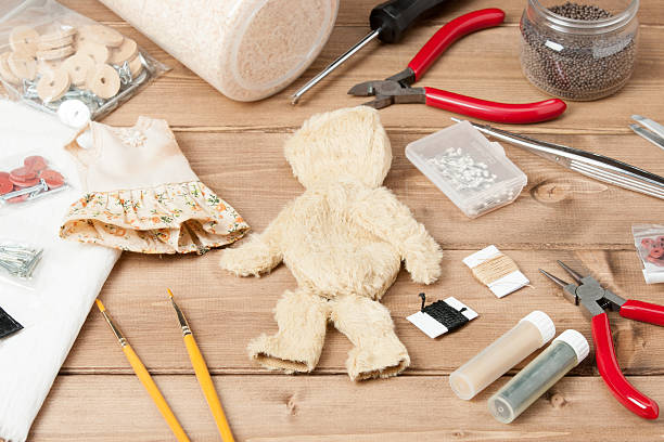 Soft Toy Creation Process. Teddy Style Bear. Sewing Accessories Soft Toy Creation Process. Teddy Style Bear. Sewing Accessories. Fur Patches. Wooden Table. behavior teddy bear doll old stock pictures, royalty-free photos & images