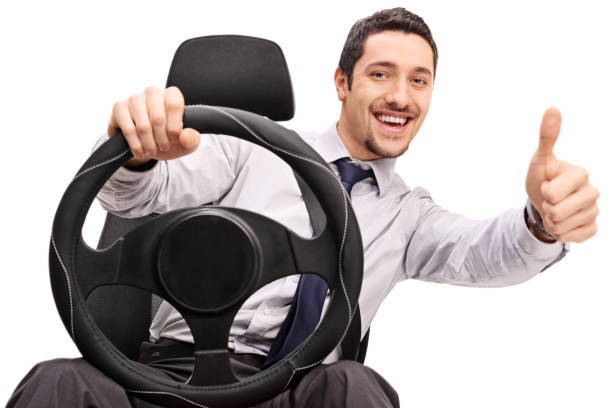 istock Young guy driving and giving a thumb up 515230108