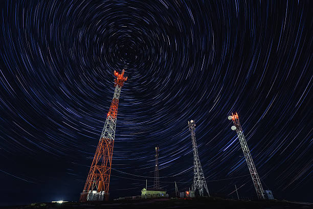 Satellite Communications Under A Starry Sky stock photo